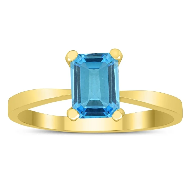 Emerald Shaped 7X5MM Blue Topaz Solitaire Ring in 10K Yellow Gold