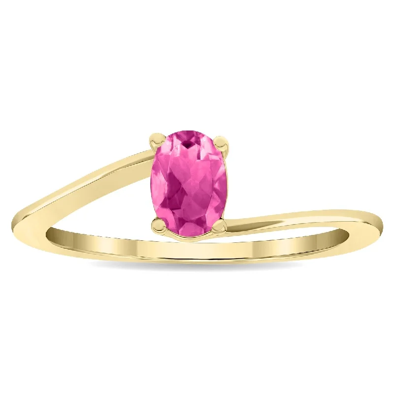 Women's Solitaire Oval Shaped Pink Topaz Wave Ring in 10K Yellow Gold